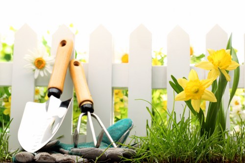Gardeners in Upminster working safely with protective equipment